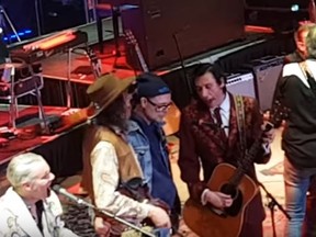 Gord Downie (jean jacket) on stage with Blue Rodeo at Massey Hall on Feb. 2, 2017. (YouTube screengrab)