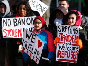 People gathered on Friday, February 3, 2017, in downtown Winnipeg to encourage Mayor Brian Bowman to make Winnipeg a sanctuary city for undocumented migrants. THE CANADIAN PRESS/John Woods