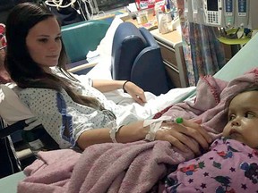 Kiersten Miles, left, greets Talia Rosko after a surgery Jan. 14, 2017, at Children's Hospital of Philadelphia where Miles donated a portion of her liver to the girl. (Farra Rosko via AP)