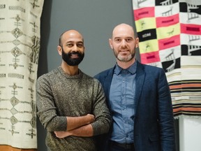 Brendan Fernandes (left) and Agnes Etherington curator Sunny Kerr, with some of Fernandes’s African textiles.