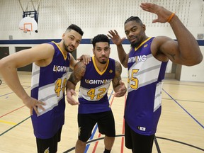 London Lightning players Ryan Anderson, Julian Boyd, and Marvin Phillips model the special sweaters they will wear in the Shine the Light game. (MORRIS LAMONT, The London Free Press)