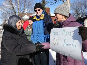 Amne Barakji Deifallah greets and thanks Andrea Prazmowski and all the members of the community who came and made a human chain around the Ottawa Mosque in sign of unity. JEAN LEVAC / POSTMEDIA NEWS