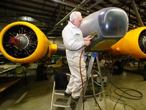 LUKE HENDRY PHOTOS/The Intelligencer
Volunteer Richard Casselman trims wood from the nose of an Avro Anson Mark II plane at the National Air Force Museum of Canada Friday at CFB Trenton. "This ain't work. This is fun," said the 82-year-old air force retiree, one of many ex-military staff now volunteering in the museum's restoration shop.