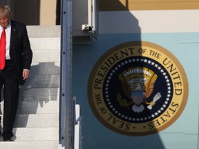 U.S. President Donald Trump walks down the steps as he arrives on Air Force One at the Palm Beach International Airport for a visit to his Mar-a-Lago Resort for the weekend on February 3, 2017 in Palm Beach, Florida. President Donald Trump is on his first visit to Palm Beach since his inauguration. (Joe Raedle/Getty Images)