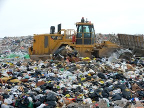 A tractor moves garbage at the city?s W12A landfill site. Unless it is expanded, the Manning Drive site will run out of space in eight years, says Jay Stanford, the city?s director of solid waste. If built up or out, it could last 25 more years. (MORRIS LAMONT, The London Free Press)