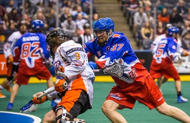 Toronto Rock Brodie Merrill during 1st half action against Buffalo Bandits Mark Steenhuis at the Air Canada Centre in Toronto, Ont. on Friday February 3, 2017. Ernest Doroszuk/Toronto Sun/Postmedia Network