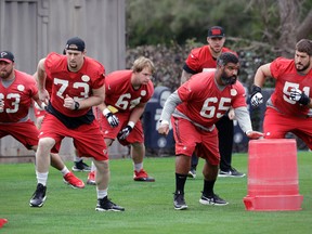 Atlanta Falcons tackle Ryan Schraeder (left) and offensive guard Chris Chester go through their drills in Houston on Friday in the run-up to Super Bowl LI. Schraeder says Atlanta’s offensive line likes to get out there and go after defences. (AP)