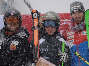 From left: Canada's second-placed Brady Leman, French winner Jean Frederic Chapuis and third-placed Alex Fiva from Switzerland , pose after the men's Ski Cross World Cup on Feldberg Mountain, in the Black Forest, Germany, Saturday Feb. 4, 2017. ( Patrick Seeger/dpa via AP)