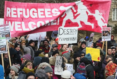 U.S. President Donald Trump's immigration policy brings out thousands of demonstrators to protest in front of the U.S. consulate on Saturday Feb. 4, 2017. (Veronica Henri/Toronto Sun)