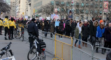 U.S. President Donald Trump's immigration policy brings out thousands of demonstrators to protest in front of the U.S. consulate on Saturday Feb. 4, 2017. (Veronica Henri/Toronto Sun)