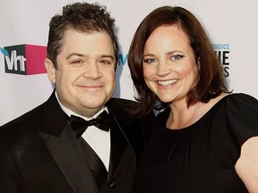 In this Jan. 12, 2012 file photo, Patton Oswalt, left, and his wife Michelle Eileen McNamara arrive at the 17th Annual Critics' Choice Movie Awards in Los Angeles. (AP Photo/Matt Sayles, File)