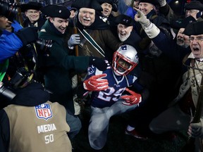 New England Patriots running back LeGarrette Blount celebrates a touchdown with the End Zone Militia during the AFC championship game against the Pittsburgh Steelers on Jan. 22, 2017. (AP Photo/Elise Amendola)