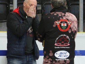 An upset Glenn Howard speaks with an official about the poor ice conditions at the Tankard in Cobourg yesterday. (Pete Fisher/Postmedia Network)