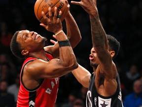 Nets forward Rondae Hollis-Jefferson (right) defends against Raptors guard Kyle Lowry (left) during first half NBA action in New York on Sunday, Feb. 5, 2017. (Kathy Willens/AP Photo)