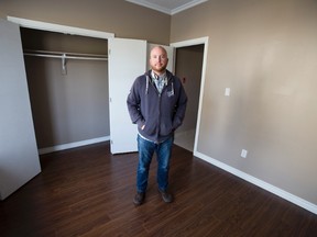Gerald Tetreault of London Cares in the living room/bedroom of an affordable housing bachelor apartment which costs $536 per month to rent in London. (DEREK RUTTAN, The London Free Press)