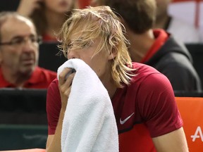 Canada’s Denis Shapovalov reacts after hitting the head of referee Arnaud Gabas with a tennis ball during the third set against Great Britain’s Kyle Edmund on Day 3 of Davis Cup action on Sunday in Ottawa. (Getty Images)