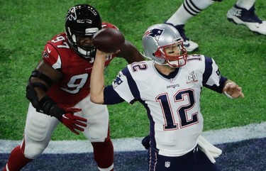 New England Patriots' Tom Brady passes under pressure from Atlanta Falcons' Grady Jarrett during the first half of the NFL Super Bowl 51 football game Sunday, Feb. 5, 2017, in Houston. (AP Photo/Charlie Riedel) ORG XMIT: NFL152