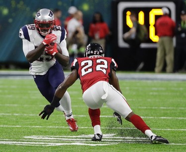 New England Patriots' LeGarrette Blount runs against Atlanta Falcons' Keanu Neal during the first half of the NFL Super Bowl 51 football game Sunday, Feb. 5, 2017, in Houston. (AP Photo/David J. Phillip) ORG XMIT: NFL153
