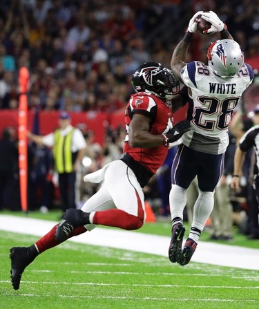 New England Patriots' James White, right, catches a pass under pressure by Atlanta Falcons' Deion Jones during the first half of the NFL Super Bowl 51 football game Sunday, Feb. 5, 2017, in Houston. (AP Photo/Elise Amendola) ORG XMIT: NFL156