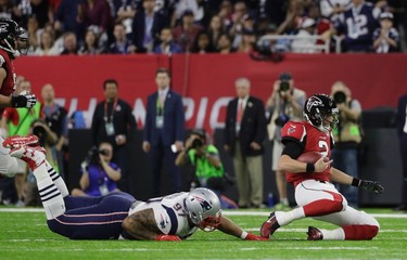Atlanta Falcons' Matt Ryan (2) slides against New England Patriots' Alan Branch (97) during the first half of the NFL Super Bowl 51 football game Sunday, Feb. 5, 2017, in Houston. (AP Photo/Mark Humphrey) ORG XMIT: NFL159