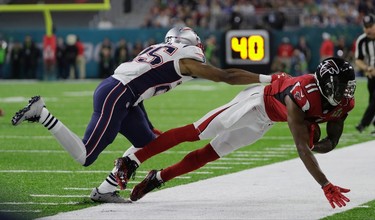 Atlanta Falcons' Julio Jones (11) makes a catch against New England Patriots' Eric Rowe (25) during the first half of the NFL Super Bowl 51 football game Sunday, Feb. 5, 2017, in Houston. (AP Photo/Mark Humphrey) ORG XMIT: NFL180