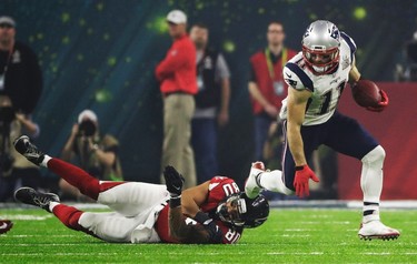 New England Patriots' Julian Edelman breaks away from Atlanta Falcons' Levine Toilolo during the second half of the NFL Super Bowl 51 football game Sunday, Feb. 5, 2017, in Houston. (AP Photo/Tony Gutierrez) ORG XMIT: NFL244