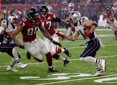 New England Patriots' Julian Edelman runs against Atlanta Falcons' Levine Toilolo on a punt return during the second half of the NFL Super Bowl 51 football game Sunday, Feb. 5, 2017, in Houston. (AP Photo/David J. Phillip) ORG XMIT: NFL245
