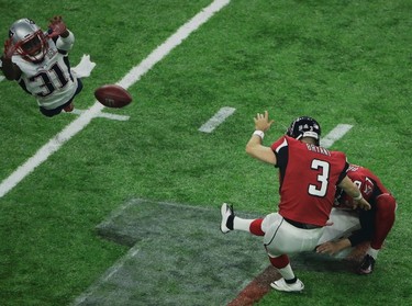 New England Patriots' Jonathan Jones, left, fails to block an extra point kick by Atlanta Falcons' Matt Bryant during the second half of the NFL Super Bowl 51 football game Sunday, Feb. 5, 2017, in Houston. (AP Photo/Charlie Riedel) ORG XMIT: NFL268