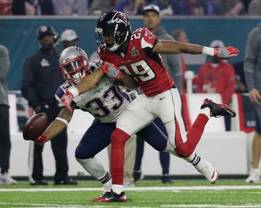Atlanta Falcons' C.J. Goodwin breaks up a pass intended for New England Patriots' Dion Lewis (33) during the second half of the NFL Super Bowl 51 football game Sunday, Feb. 5, 2017, in Houston. (AP Photo/Mark Humphrey) ORG XMIT: NFL273