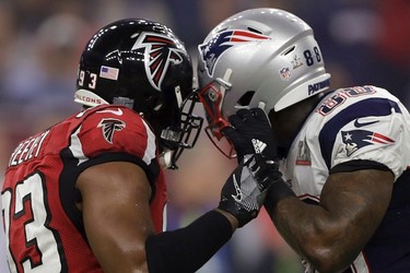 New England Patriots' Martellus Bennett helmet is locked with Atlanta Falcons' Dwight Freeney, during the second half of the NFL Super Bowl 51 football game Sunday, Feb. 5, 2017, in Houston. (AP Photo/Darron Cummings) ORG XMIT: NFL275