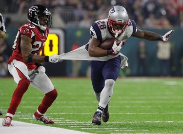 New England Patriots' James White runs against Atlanta Falcons' Robert Alford during the second half of the NFL Super Bowl 51 football game Sunday, Feb. 5, 2017, in Houston. (AP Photo/Mark Humphrey) ORG XMIT: NFL289