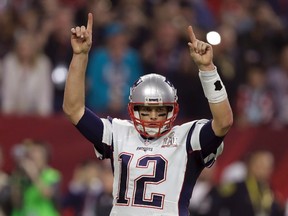 New England Patriots' Tom Brady raises his arms after a touchdown, during the second half of the NFL Super Bowl 51 football game against the Atlanta Falcons, Sunday, Feb. 5, 2017, in Houston. (AP Photo/Darron Cummings)