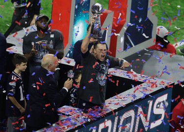 New England Patriots' Tom Brady celebrates with the Vince Lombardi Trophy after winning the NFL Super Bowl 51 football game against the Atlanta Falcons, Sunday, Feb. 5, 2017, in Houston. (AP Photo/Charlie Riedel) ORG XMIT: NFL402