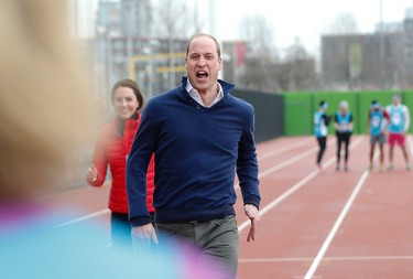 Prince William, centre, and Kate Duchess of Cambridge, take part in a short relay race, during a training event to promote the charity Heads Together, at the Queen Elizabeth II Park in London, Sunday, Feb. 5, 2017. (AP Photo/Alastair Grant, Pool)