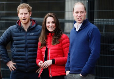 Prince William, right, Kate the  Duchess of Cambridge, centre, and Prince Harry look down the track as they arrive to take part in a short relay race, during a training event to promote the charity Heads Together, at the Queen Elizabeth II Park in London, Sunday, Feb. 5, 2017. (AP Photo/Alastair Grant, Pool)
