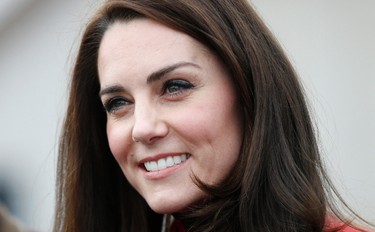 Kate, the Duchess of Cambridge, talks to runners as she prepares to take part in a relay race, during a training event to promote the charity Heads Together, at the Queen Elizabeth II Park in London, Sunday, Feb. 5, 2017. (AP Photo/Alastair Grant, Pool)