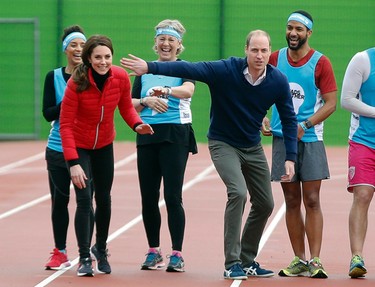 Kate, Duchess of Cambridge, left, and Prince William, Duke of Cambridge (2nd R) share a joke at the start of a relay race, during a training event to promote the charity Heads Together, at the Queen Elizabeth Olympic Park in London, on February 5, 2017. ALASTAIR GRANT/AFP/Getty Images