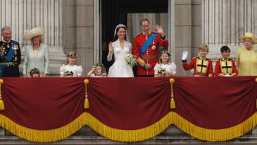 FILE - In this Friday, April, 29, 2011 file photo, Britain's Prince William and his wife Kate, Duchess of Cambridge wave with Britain's Queen Elizabeth II, from the balcony of Buckingham Palace after the Royal Wedding in London. On Monday Feb. 6, 2017, Queen Elizabeth II marks her Sapphire Jubilee, becoming the first British monarch to reign for 65 years. (AP Photo/Matt Dunham, File)