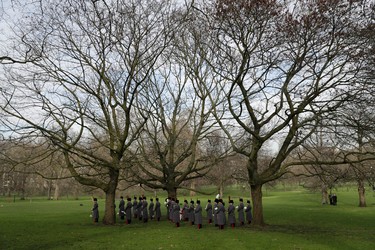 The Royal Artillery Band stand underneath trees before The King's Troop Royal Horse Artillery arrived to stage a 41-Gun Royal Salute to celebrate Britain's Queen Elizabeth II's Sapphire Jubilee, marking the 65th anniversary of her accession to the throne in Green Park, London, Monday, Feb. 6, 2017. The 90-year-old queen has become the first British monarch to reach the milestone of 65 years on the throne. (AP Photo/Matt Dunham)