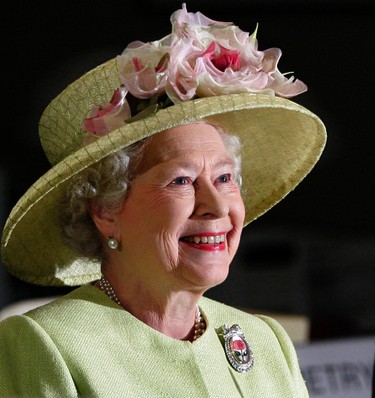FILE - In this May 8, 2007 file photo, Britain's Queen Elizabeth II smiles as she is greeted by astronauts aboard the International Space Station, via video conference, during her visit to NASA's Goddard Flight Center in Greenbelt, Md..  On Monday Feb. 6, 2017, Queen Elizabeth II marks her Sapphire Jubilee, becoming the first British monarch to reign for 65 years. (AP Photo/J. Scott Applewhite, File)