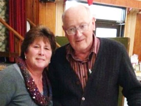 New Mitchell & District Agricultural Society President Winnie Linton (left) gives Past President David Kemp a photo album of the renovation projects that Kemp spearheaded during his tenure. SUBMITTED