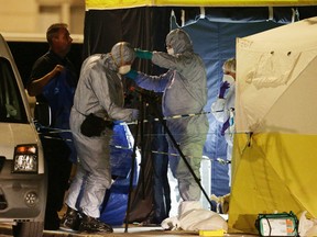 In this Aug. 4, 2016 file photo, police forensic officers at work in Russell Square, central London, after a knife attack. A teenager has admitted killing a retired Florida teacher and injuring five other people in a stabbing rampage near the British Museum in London. Somali-Norwegian Zakaria Bulhan, 19, pleaded guilty to manslaughter by diminished responsibility in the Aug. 3 slaying of 64-year-old Darlene Horton.