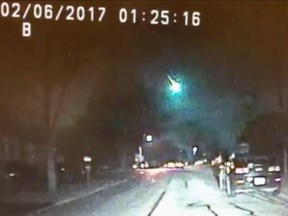 This image from a dashcam video provided by the Lisle Police Department in Lisle, Ill., shows a meteor as it streaked over Lake Michigan early Monday morning, Feb. 6, 2017. The meteor lit up the sky across several states in the Midwest. (Lisle (Ill.) Police Department via AP)