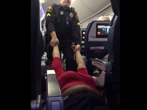 Rhima Coleman being dragged off a plane.