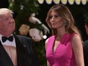 US President Donald Trump and First Lady Melania Trump arrive for the 60th Annual Red Cross Gala at his Mar-a-Lago estate in Palm Beach on February 4, 2017. / AFP PHOTO / MANDEL NGANMANDEL NGAN/AFP/Getty Images