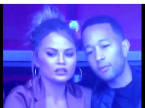 Chrissy Teigen and John Legend during the Super Bowl (Twitter screen grab)