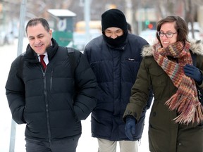 Will Baker, formerly known as Vince Li, leaves the Law Courts building in Winnipeg, after his annual criminal code review board hearing with his lawyer Alan Libman, left, Monday, February 6, 2017. A schizophrenic man who beheaded and cannibalized a fellow passenger on a Greyhound bus could know later this week whether he will be granted his freedom. THE CANADIAN PRESS/Trevor Hagan