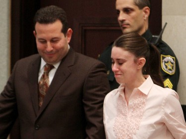 Casey Anthony with her attorney Jose Baez smiles after knowing that she has been acquitted of murder charges at the Orange County Courthouse on July 5, 2011 in Orlando, Fla.  (Red Huber-Pool/Getty Images)