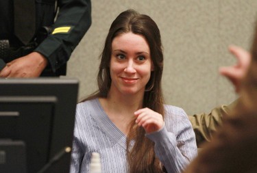 Casey Anthony smiles before the start of her sentencing hearing on charges of lying to a law enforcement officer at the Orange County Courthouse July 7, 2011 in Orlando, Fla. She was acquitted of murder charges on July 5, but was ordered to serve four, one-year sentences on her conviction of lying to a law enforcement officer. Due to time served, she was released July 13.  (Joe Burbank-Pool/Getty Images)