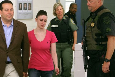 Casey Anthony (2L) leaves with her attorney Jose Baez (L) from the  Booking and Release Center at the Orange County Jail after she was acquitted of murdering her daughter Caylee Anthony on July 17, 2011 in Orlando, Fla. (Red Huber-Pool/Getty Images)
